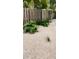 Landscaped backyard with wooden fence and gravel ground cover at 523 Reid St, Sarasota, FL 34242