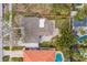 Aerial view of the house featuring a well-maintained roof, backyard, and landscaping at 745 Bruce Ave, Clearwater Beach, FL 33767