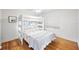 Bright bedroom with a white bunk bed, hardwood floors, and natural light at 745 Bruce Ave, Clearwater Beach, FL 33767