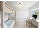 Bedroom with a bunk bed, desk, chair, and a bright window at 745 Bruce Ave, Clearwater Beach, FL 33767