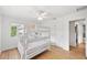 Cozy bedroom featuring a bunk bed, hardwood floors, and natural lighting at 745 Bruce Ave, Clearwater Beach, FL 33767