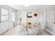 Charming dining area with a glass table and stylish wicker chairs at 745 Bruce Ave, Clearwater Beach, FL 33767