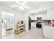 Bright kitchen with white cabinets, stainless steel appliances, and a breakfast nook at 745 Bruce Ave, Clearwater Beach, FL 33767