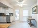 Bright, renovated kitchen featuring white cabinets, stainless steel appliances, and tile flooring at 745 Bruce Ave, Clearwater Beach, FL 33767
