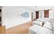 Living Room featuring wood floors, a sliding barn door, and a modern white sectional at 745 Bruce Ave, Clearwater Beach, FL 33767