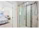 Bathroom with a glass-enclosed shower featuring decorative tile accents and a modern fixture at 745 Bruce Ave, Clearwater Beach, FL 33767
