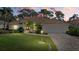 Single-story home with tile roof and landscaped lawn at 8111 Fairhaven Glen, University Park, FL 34201
