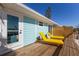 Relaxing deck with yellow lounge chairs, offering outdoor space at 303 65Th St # B, Holmes Beach, FL 34217