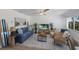 Bright living room with comfy seating and beachy decor at 303 65Th St # B, Holmes Beach, FL 34217