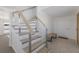 Modern staircase with light wood and cable railing at 303 65Th St # B, Holmes Beach, FL 34217