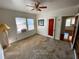 Bright bedroom with carpet flooring, ceiling fan, and window at 3642 Dartmouth N Ave, St Petersburg, FL 33713