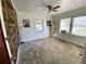 Bedroom with wood-look accent wall and ceiling fan at 3642 Dartmouth N Ave, St Petersburg, FL 33713