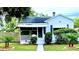 Quaint white bungalow home with a well-manicured lawn at 3642 Dartmouth N Ave, St Petersburg, FL 33713