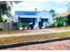 Charming bungalow with white exterior, landscaping, and brick walkway at 3642 Dartmouth N Ave, St Petersburg, FL 33713