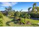 Landscaped backyard with tropical plants at 5397 Bartolomeo St, Sarasota, FL 34238