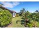 Landscaped backyard with lush greenery at 5397 Bartolomeo St, Sarasota, FL 34238