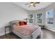 Bright bedroom with a queen bed and bay window at 5397 Bartolomeo St, Sarasota, FL 34238