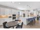 Modern kitchen with white cabinets, stainless steel appliances, and an island at 5397 Bartolomeo St, Sarasota, FL 34238