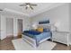 Spacious main bedroom with king bed, neutral decor, and access to ensuite bath at 5397 Bartolomeo St, Sarasota, FL 34238