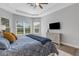 Serene main bedroom featuring a king bed, ample natural light, and a TV at 5397 Bartolomeo St, Sarasota, FL 34238