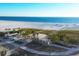 Aerial view of beach, boardwalk, and shoreline at 7618 Midnight Pass Rd, Sarasota, FL 34242