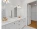 Spa-like bathroom with double vanity, quartz countertops, and gold fixtures at 10124 Silent Night Ln, Sarasota, FL 34241