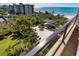 Aerial view of community with lush landscaping and oceanfront at 1211 Gulf Of Mexico Dr # 408, Longboat Key, FL 34228