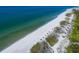Aerial view of beach with white sand and turquoise water at 1211 Gulf Of Mexico Dr # 408, Longboat Key, FL 34228
