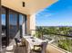 Balcony with city view and outdoor dining set at 1211 Gulf Of Mexico Dr # 408, Longboat Key, FL 34228