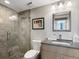 Bathroom with walk-in shower, tiled floors and modern vanity at 1211 Gulf Of Mexico Dr # 408, Longboat Key, FL 34228
