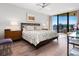 King-size bed, hardwood floors, and ocean views from a condo bedroom at 1211 Gulf Of Mexico Dr # 408, Longboat Key, FL 34228