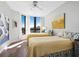 Guest bedroom with twin beds, hardwood floors, and ocean views at 1211 Gulf Of Mexico Dr # 408, Longboat Key, FL 34228