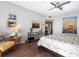 Bright bedroom with large windows, hardwood floors, and artwork at 1211 Gulf Of Mexico Dr # 408, Longboat Key, FL 34228