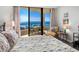 King-size bed, hardwood floors, and ocean view from a condo bedroom at 1211 Gulf Of Mexico Dr # 408, Longboat Key, FL 34228