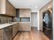 Modern kitchen with granite countertops and stainless steel appliances at 1211 Gulf Of Mexico Dr # 408, Longboat Key, FL 34228