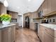 Modern kitchen with granite countertops and stainless steel appliances at 1211 Gulf Of Mexico Dr # 408, Longboat Key, FL 34228
