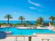 Inviting pool area with ocean views and a hot tub at 1211 Gulf Of Mexico Dr # 408, Longboat Key, FL 34228