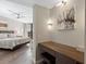 Elegant vanity area with a wooden desk and a view into the bedroom at 1211 Gulf Of Mexico Dr # 408, Longboat Key, FL 34228