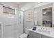 Spa-like bathroom with a walk-in shower and gray vanity at 13021 Indigo Way, Bradenton, FL 34211