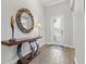 Bright and spacious entryway with a large mirror and console table at 13021 Indigo Way, Bradenton, FL 34211