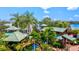 Aerial view of a vibrant miniature golf course with tropical landscaping at 13021 Indigo Way, Bradenton, FL 34211