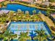 Aerial view of community pickleball courts with players at 13021 Indigo Way, Bradenton, FL 34211