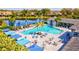 Resort-style pool with ample seating and umbrellas at 13021 Indigo Way, Bradenton, FL 34211