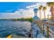 Scenic waterfront view with a charming clock tower and boardwalk at 13021 Indigo Way, Bradenton, FL 34211
