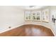 Bright bedroom with hardwood floors and ceiling fan at 6600 Deering Cir, Sarasota, FL 34240