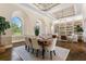 Elegant dining room with built-in shelving and hardwood floors at 8965 Bunker Hill Rd, Duette, FL 34219