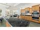 Modern kitchen boasts granite countertops and stainless steel appliances at 8965 Bunker Hill Rd, Duette, FL 34219