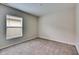 Simple bedroom with window, neutral walls, and carpet at 1006 Hagle Park Rd, Bradenton, FL 34212