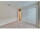 Bright bedroom with ample closet space and neutral carpeting at 1006 Hagle Park Rd, Bradenton, FL 34212