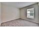 Simple bedroom with a window and carpet flooring at 1006 Hagle Park Rd, Bradenton, FL 34212